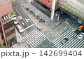 Looking down at street traffic next to Port Authority bus terminal NYC 142699404
