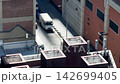 Quiet Manhattan NYC side street traffic and pedestrians sunny day 142699405