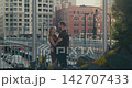 Romantic couple embracing on a city bridge 142707433