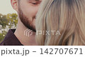 Romantic couple kissing deeply and passionately outdoors 142707671