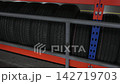 New car tires for sale in a warehouse store 142719703