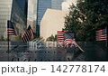 American flags at September 11 memorial reflecting pool 142778174