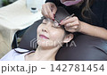 A woman wearing eyelash extensions 142781454