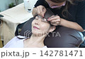 A woman wearing eyelash extensions 142781471