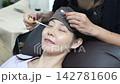 A woman wearing eyelash extensions 142781606