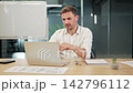 Business Professional Engaged In Virtual Office Discussion 142796112