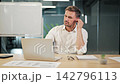 Focused Business Professional Engaging In Virtual Office Call. 142796113