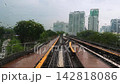 KL Monorail Train wet window POV moving by rail track in Rainy Weather with Oncoming Train 142818086