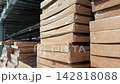 Flat Pack Cardboard Boxes Stacked on Warehouse Shelves Close Up 142818088