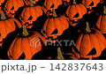Multiple carved orange pumpkins with triangular eyes and scary expressions and glowing faces creating spooky Halloween autumn atmosphere. 3d rendering animation. 142837643