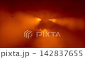 Glowing Halloween jack-o-lantern face in orange red fog with falling autumn leaves silhouettes. Spooky pumpkin glow atmospheric horror holiday background. Seamless loop 3d rendering animation. 142837655