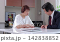 Senior men and women holding a meeting in the office 142838852