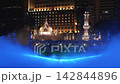 Masjid Jamek Mosque Domes and Minaret illuminated in Blue Mist of River of Life at Night 142844896