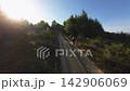 Trail Running Woman Aerial Drone Tracking Shot Mountain Determined Golden Hour 142906069