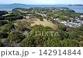 Aerial shot of Nagoya Castle in Saga Prefecture, Kyushu, receding into the distance with the sea behind it. 142914844