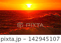Sunset ocean waves beautiful sunset over ocean waves with vibrant orange sky and reflection on water during golden hour 142945107