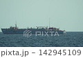 Dredge ship, sea, water A large industrial vessel navigating calm blue ocean under clear sky. 142945109