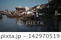 Traditional Boats with Passengers on a Calm Day in a Historical Water Town. Zhujiajiao, Shanghai, China Traditional Boats with Passengers on a Calm Day in a Historical Water Town. Zhujiajiao, Shanghai, China 142970519
