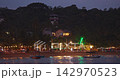 evening cafe is illuminated with lights. Tables are set out on the beach sand by the ocean. Laccadive sea Ocean tropical resorts. Sri Lanka, Unawatuna. Unawatuna beach evening cafe is illuminated with lights. Tables are set out on the beach sand by the ocean. Laccadive sea Ocean tropical resorts. Sri Lanka, Unawatuna. Unawatuna beach 142970523