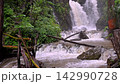 Scenic Huai Nam Yen Waterfall cascading through lush tropical rainforest in the rainy season in Omkoi District Chiang Mai, Thailand 142990728