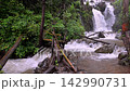 Scenic Huai Nam Yen Waterfall cascading through lush tropical rainforest in the rainy season in Omkoi District Chiang Mai, Thailand 142990731