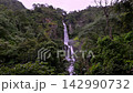 Scenic Huai Nam Yen Waterfall cascading through lush tropical rainforest in the rainy season in Omkoi District Chiang Mai, Thailand 142990732