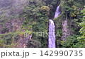 Scenic Huai Nam Yen Waterfall cascading through lush tropical rainforest in the rainy season in Omkoi District Chiang Mai, Thailand 142990735