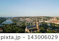 Witness the captivating beauty of Vysehrad Basilica of St. Peter and St. Paul in Prague during a serene sunrise. The vibrant colors illuminate the historic church and surrounding landscape. 143006029