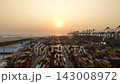 Aerial view container cargo ship loading unloading at night, Container cargo ship import export sea port, Global trade business container cargo ship freight shipping commercial trade logistic 143008972