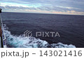 A scene from a ship sailing through the sea as dusk approaches, rocking violently and kicking up spray (rough waves, stormy seas, 20 seconds). 143021416