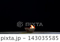 Flames are burning in a bowl isolated on a black background. Concept of particles, sparkles, flame and light. 143035585