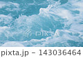 Turquoise ocean waves swirling with white sea foam, creating a dynamic natural water texture and abstract marine background. Slow motion video. 143036464