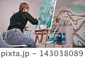 The artist paints a picture. 143038089