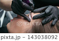 Permanent Makeup Artist Performing Eyebrow Tattoo 143038092