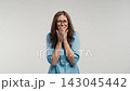 Frightened female doctor screaming and panicking, nervous healthcare professional reacting with fear 143045442