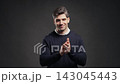 Smiling adult man applauds with open smile,active body language.Celebration, positive expression 143045443