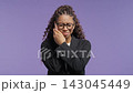 Pretty school-girl holding cheek with painful expression. College student woman suffering from 143045449