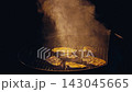 Fresh Salmon Grilling on Barbecue Rack With Smoke During Evening Dinner. Appetizing seafood, outdoor 143045665