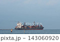 Coastal scenery and maritime landscape with container ships sailing along the shore. 143060920