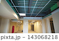 Spacious brightly lit hall with columns and glowing lamps 143068218