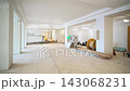 Construction materials in empty hall with large columns 143068231