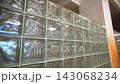 Glass block wall and column separates enclosure in rooms 143068234