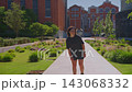 A Young Woman Enjoys a Sunny Day in a Vibrant Urban Park, Captured in Two Frames: Skating and Reflective Moments Amidst Lush Greenery 143068332