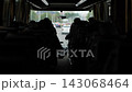 Bus interior with silhouetted passengers traveling on a city road 143068464