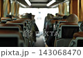 Bus passenger viewing screen on seat back while traveling, enjoying a long journey 143068470