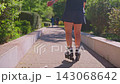 A Scenic Stroll and Skating Journey Through a Lush Green Park, Showcasing the Joy of Outdoor Activities Amidst Nature's Beauty and Vibrant Surroundings. 143068642