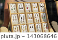 Handmade artisan earrings display at a craft market, offering unique jewelry designs 143068646