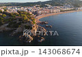 Aerial view taken from a drone of the coast of Lloret de Mar, Costa Brava, Spain, early in the morning at sunrise - the sea, beach and coastal hotels 143068674
