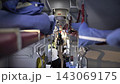 Long-distance train compartment with bunk beds and passengers traveling 143069175