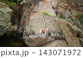 Overhead View of Woman Beside Na Muang Waterfall 2 on Koh Samui 143071972
